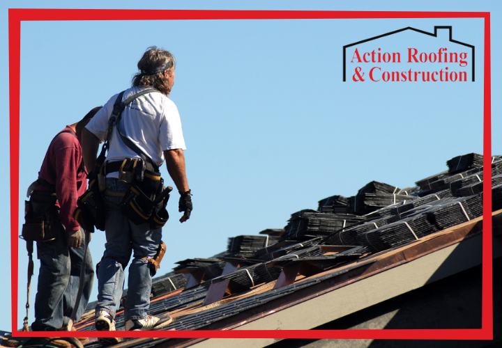 2 Clive roofing pros preparing tor install new shingles on the roof of a home.