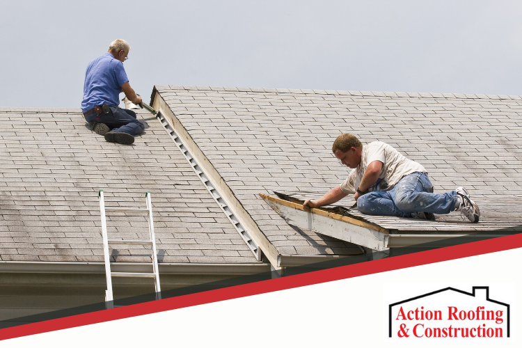 Two Des Moines roof repair pros at work