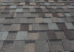A freshly installed composition asphalt shingle roof by a local Clive roofer