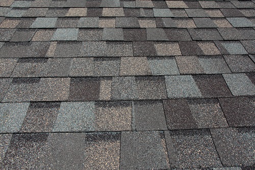 A freshly installed composition asphalt shingle roof by a local Clive roofer
