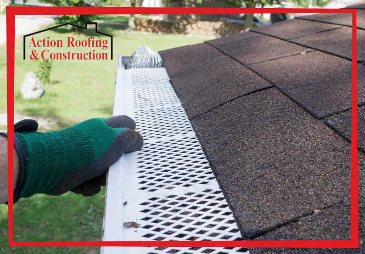 Residential house protected from water damage with proper gutter maintenance and Ankeny roof repair protection services.