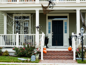 Ankeny roofer showing how to hang Halloween decorations safely.