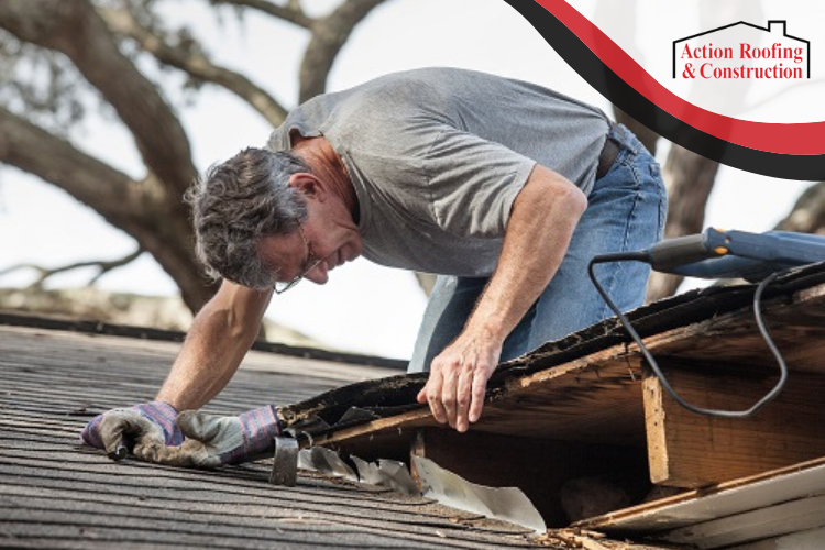 Des Moines homeowner inspecting roof for leaks, guided by Action Roofing's expert advice.
