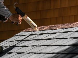 Action Roofing professional performs a roof leak repair in Des Moines.