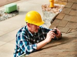 Des Moines roofers assessing a roof for snow avalanche prevention