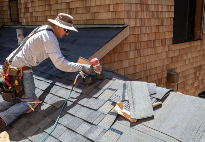 Action Roofing repairing a storm-damaged roof in Clive.