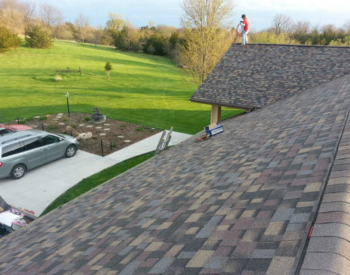 Urbandale roofer performing seasonal roof maintenance